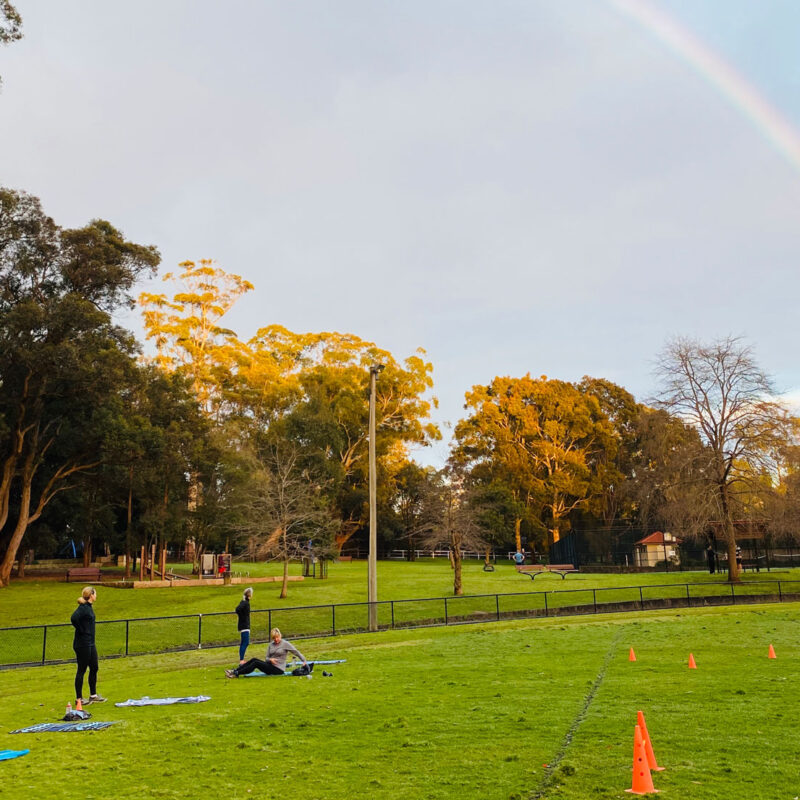 man pointing at rainbow in turramurra
